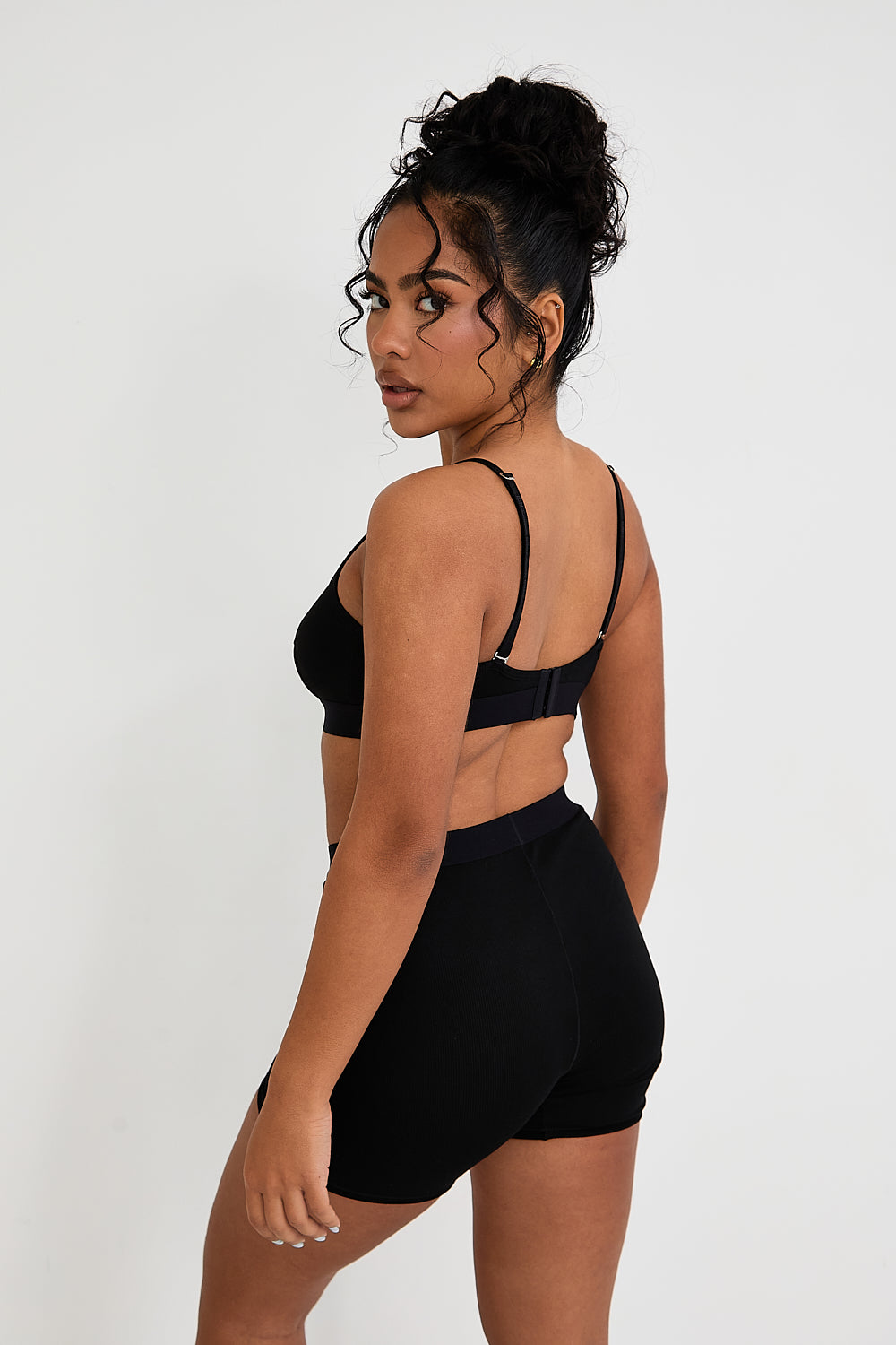 Our Ribbed Boxer in Black is the ideal choice for those seeking more coverage. With its high-rise waist and comfortable, full-coverage design, this boxer is sure to become a staple in your collection. The ribbed fabric provides a tailored fit while the elastic waistband, adorned with our signature logo, ensures a secure, all-day hold. Whether you're relaxing at home or getting ready for bed, these boxers offer unmatched comfort.