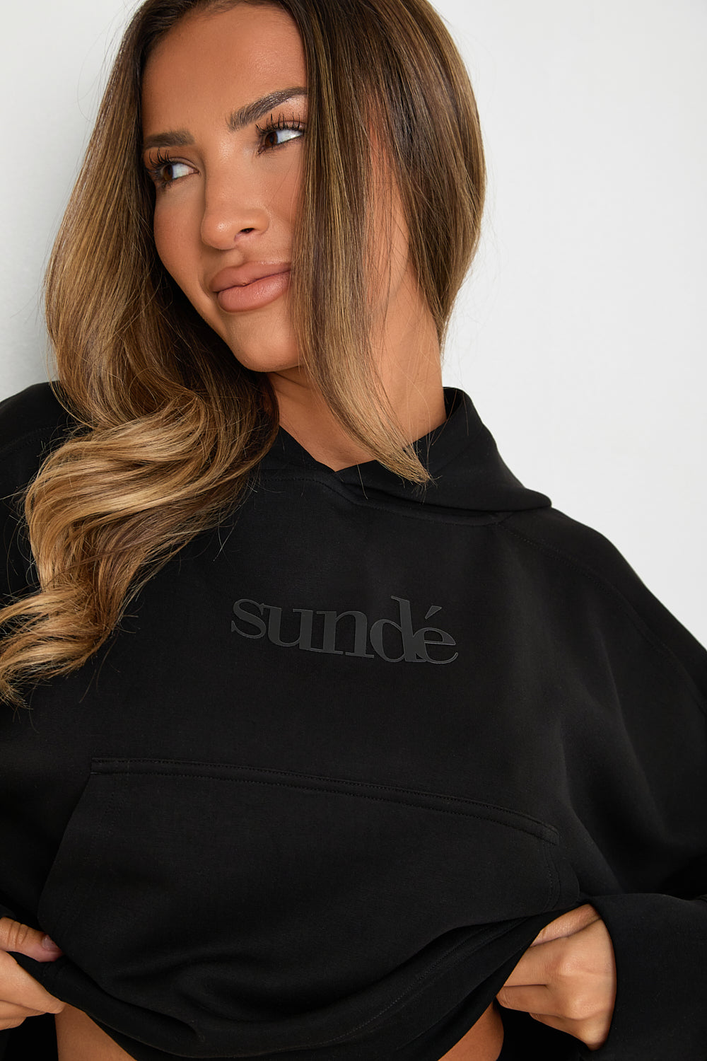 this Black Boxy Cropped Hoodie is the perfect addition to any loungewear collection. Its soft and comfortable fabric makes it ideal for lazy Sundays, while its matching modal blend flare joggers and ribbed boxer pants create a stylish, yet relaxed look.