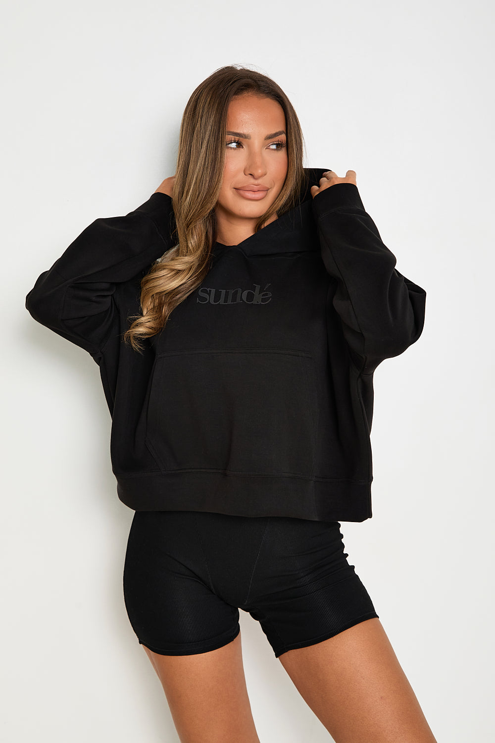 this Black Boxy Cropped Hoodie is the perfect addition to any loungewear collection. Its soft and comfortable fabric makes it ideal for lazy Sundays, while its matching modal blend flare joggers and ribbed boxer pants create a stylish, yet relaxed look.