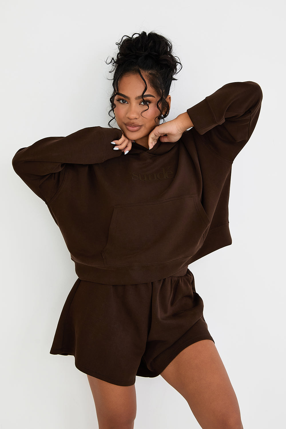 Stay cozy and stylish with our Boxy Cropped Hoodie in rich Chocolate. Made from soft modal, it's perfect for lazy days, paired with matching lounge shorts. Our signature tonal rubber print adds a subtle and sophisticated touch. Upgrade your loungewear collection today.