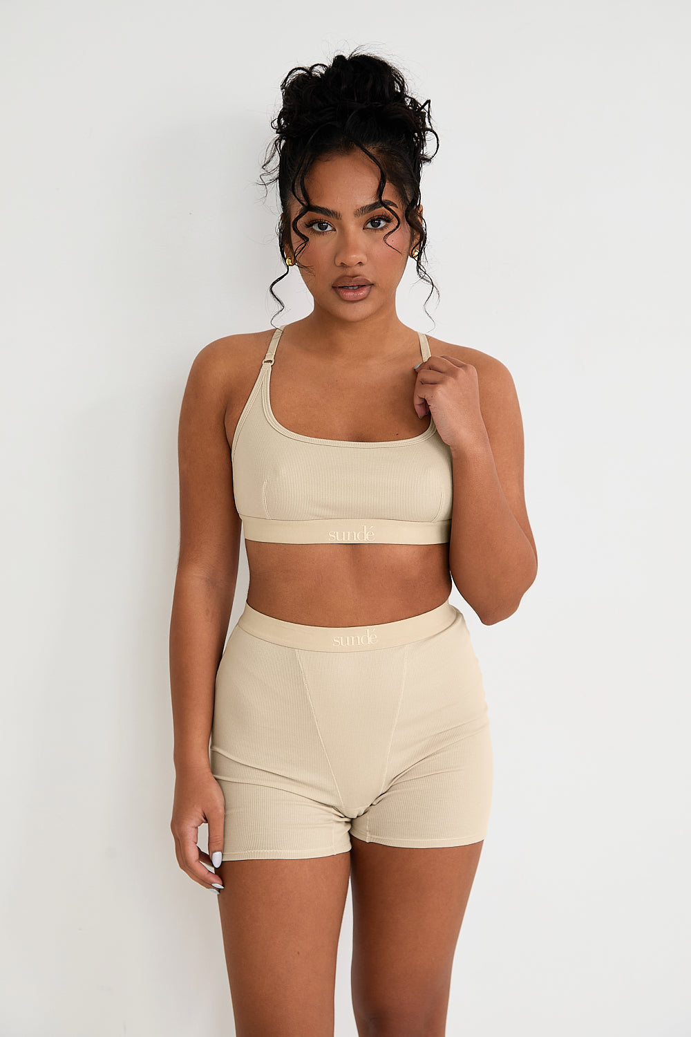 Discover luxurious comfort and support with our Ribbed Strappy Bralet in latte. Featuring a seamless design, flattering scoop neckline, and 2-way adjustable straps, this bralet offers a customised fit and smooth lines under any outfit. The soft ribbed texture adds sophistication, while the breathable blend of Lyocel, cotton, and spandex ensures all-day comfort.