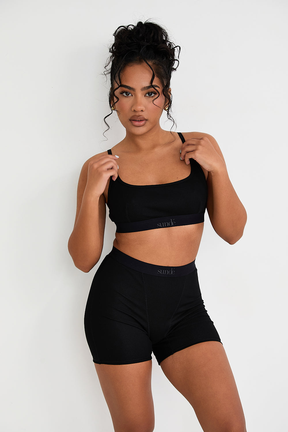 Our Ribbed Boxer in Black is the ideal choice for those seeking more coverage. With its high-rise waist and comfortable, full-coverage design, this boxer is sure to become a staple in your collection. The ribbed fabric provides a tailored fit while the elastic waistband, adorned with our signature logo, ensures a secure, all-day hold. Whether you're relaxing at home or getting ready for bed, these boxers offer unmatched comfort.