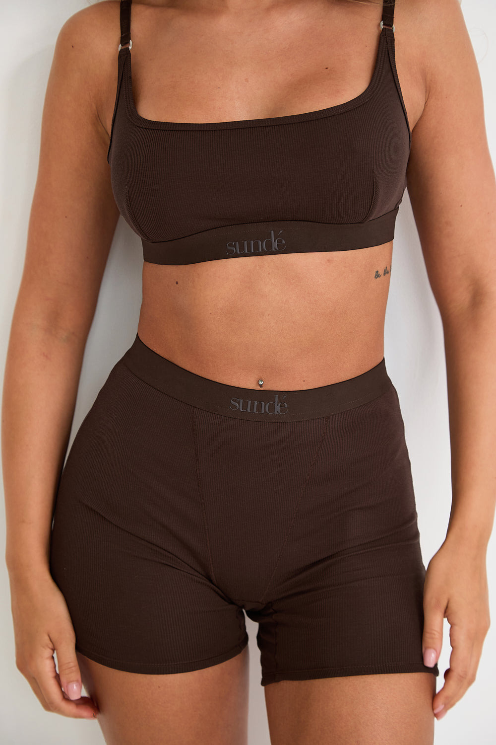 Introducing our Ribbed Strappy Bralet in chocolate - the perfect blend of style and comfort. Made with breathable Lyocel, cotton, and spandex, this seamless bralet offers soft support and a flattering scoop neckline. The 2-way adjustable straps allow for a customised fit, making it ideal for lounging and layering. Elevate your everyday look with its sophisticated ribbed texture.