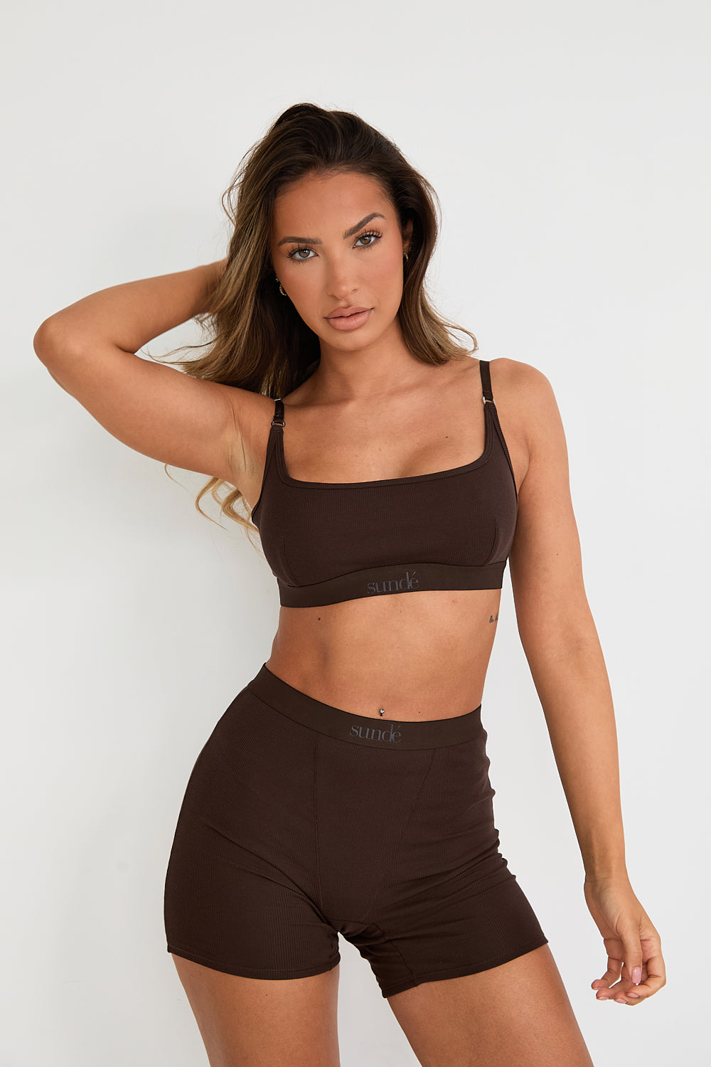 Introducing our Ribbed Strappy Bralet in chocolate - the perfect blend of style and comfort. Made with breathable Lyocel, cotton, and spandex, this seamless bralet offers soft support and a flattering scoop neckline. The 2-way adjustable straps allow for a customised fit, making it ideal for lounging and layering. Elevate your everyday look with its sophisticated ribbed texture.