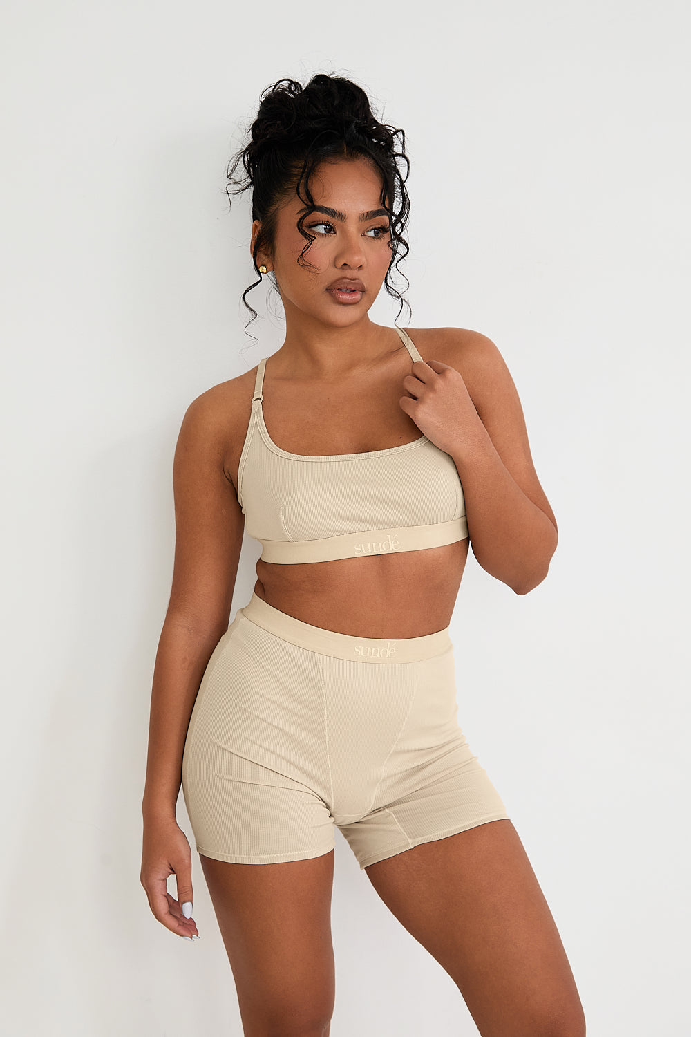 Discover luxurious comfort and support with our Ribbed Strappy Bralet in latte. Featuring a seamless design, flattering scoop neckline, and 2-way adjustable straps, this bralet offers a customised fit and smooth lines under any outfit. The soft ribbed texture adds sophistication, while the breathable blend of Lyocel, cotton, and spandex ensures all-day comfort.