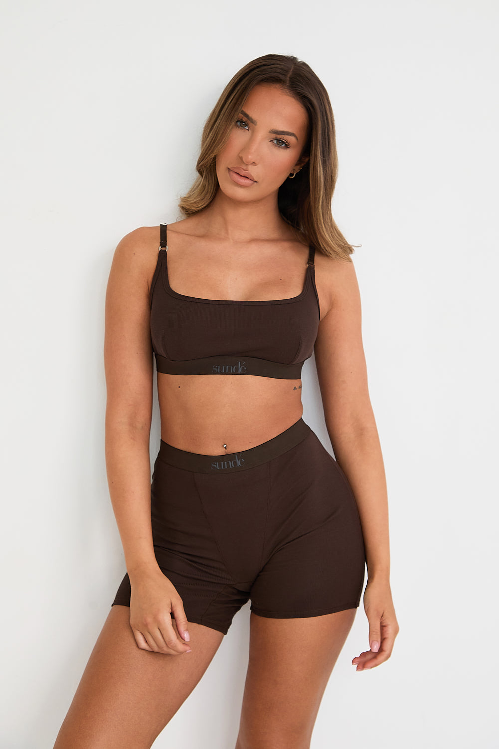 Introducing our Ribbed Strappy Bralet in chocolate - the perfect blend of style and comfort. Made with breathable Lyocel, cotton, and spandex, this seamless bralet offers soft support and a flattering scoop neckline. The 2-way adjustable straps allow for a customised fit, making it ideal for lounging and layering. Elevate your everyday look with its sophisticated ribbed texture.