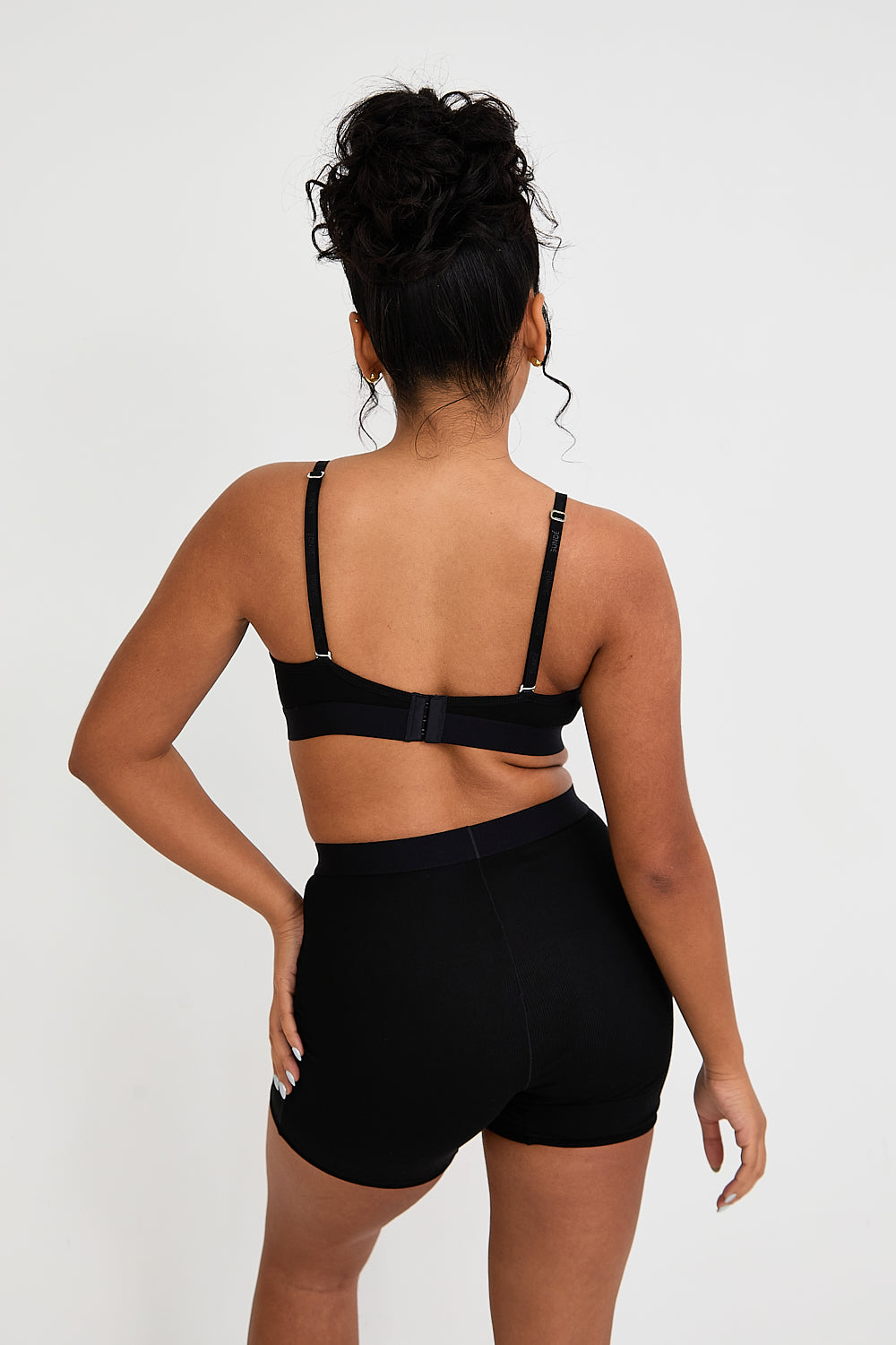 Our Ribbed Boxer in Black is the ideal choice for those seeking more coverage. With its high-rise waist and comfortable, full-coverage design, this boxer is sure to become a staple in your collection. The ribbed fabric provides a tailored fit while the elastic waistband, adorned with our signature logo, ensures a secure, all-day hold. Whether you're relaxing at home or getting ready for bed, these boxers offer unmatched comfort.